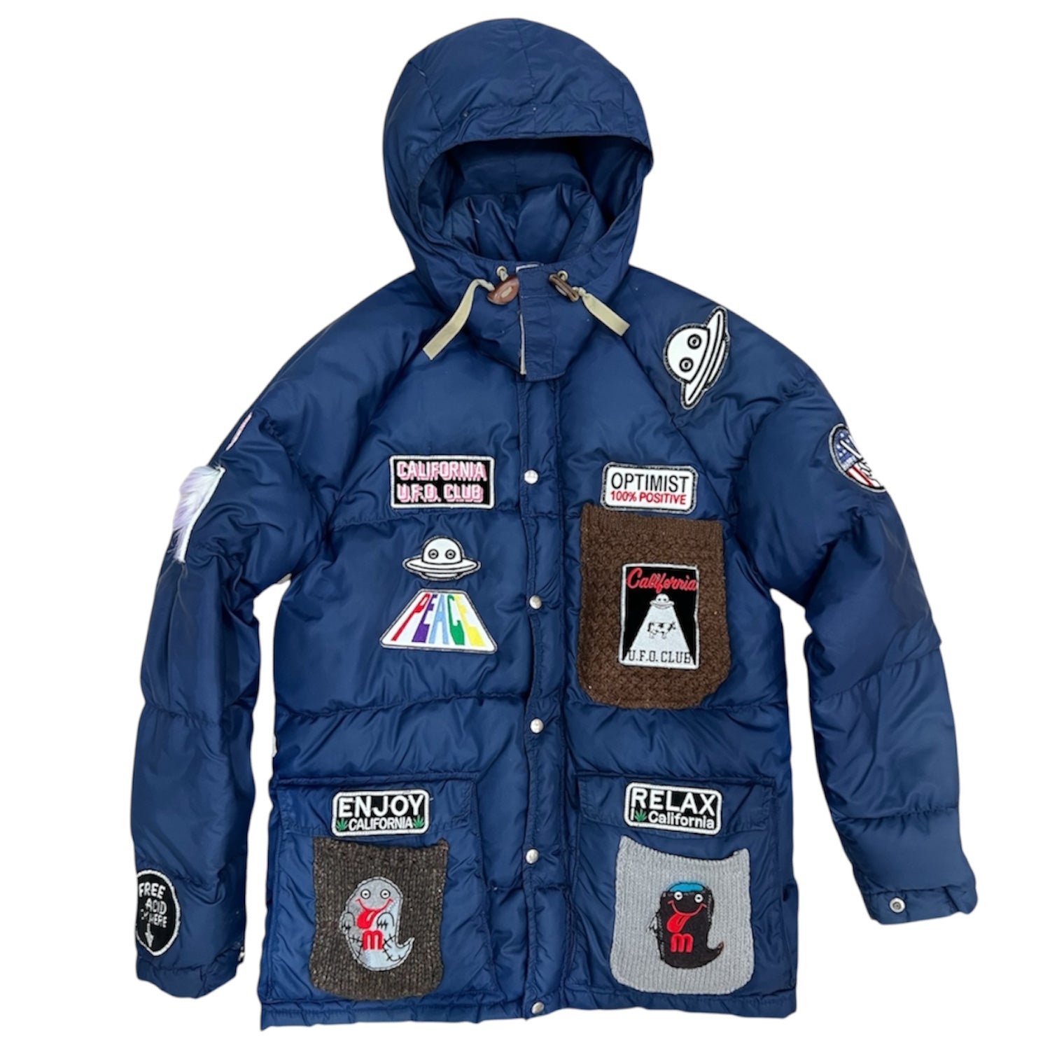 A Love Movement Puffer Jacket with fun patches