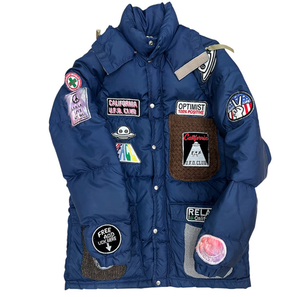 A Love Movement Puffer Jacket with fun patches