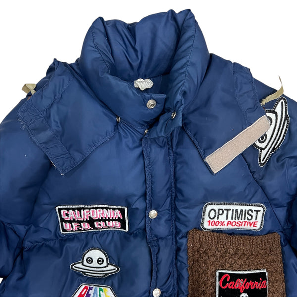 A Love Movement Puffer Jacket with fun patches